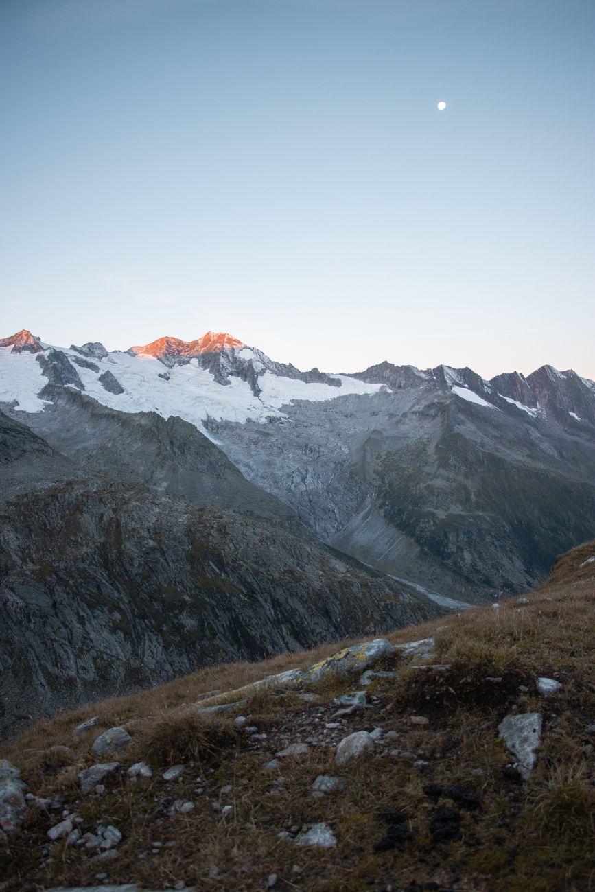 Golden sunset reflecting off pristine glacial mountains and lakes
